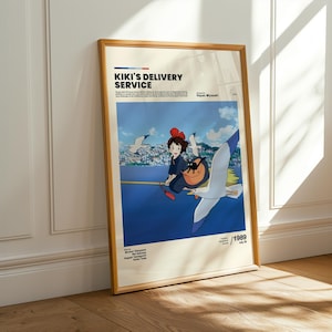 Puede incluir: P&oacute;ster enmarcado de la pel&iacute;cula de animaci&oacute;n "Nicky, la aprendiz de bruja". La obra muestra a una joven en una escoba con una gaviota, sobre un cielo azul y mar. El p&oacute;ster incluye el t&iacute;tulo de la pel&iacute;cula y el a&ntilde;o 1989.