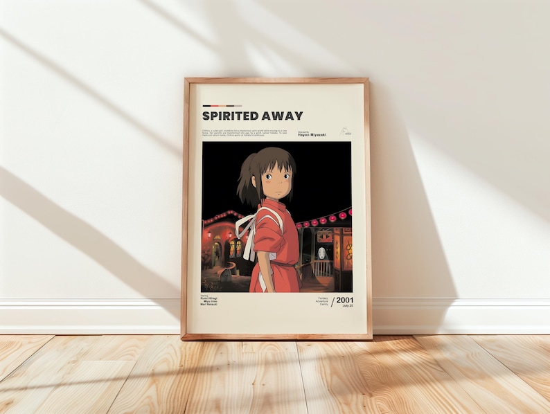 May include: Framed poster featuring the animated film "Spirited Away." The artwork depicts a young girl in a red dress, set against a backdrop of a nighttime scene with lanterns. The poster includes the film's title and the year 2001.
