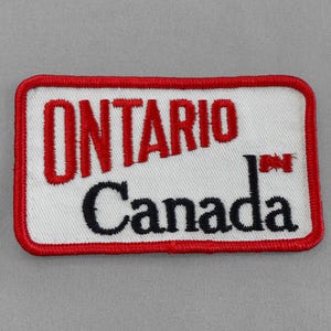 May include: Red and white embroidered patch with the text "ONTARIO Canada" and a small Canadian flag.