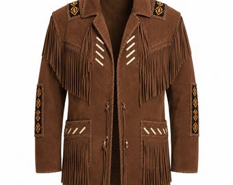 May include: A brown suede jacket featuring long fringe detailing across the chest and pockets. The garment includes braided trim, cream-colored stitching accents, and decorative panels on the shoulders and sleeves with geometric patterns.