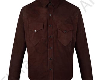 May include: A dark brown suede shirt with long sleeves, a button-down front, and two chest pockets. The shirt has a classic collar and decorative stitching details. The buttons are dark, and the overall style is Western-inspired.