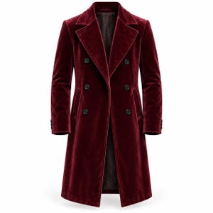May include: A deep burgundy velvet double-breasted coat featuring a wide notched lapel, long sleeves with buttoned cuffs, and six black buttons arranged in two vertical rows on the front. The coat has a smooth dark interior lining.