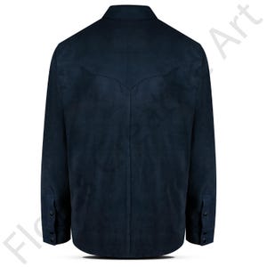 May include: A navy blue suede shirt with long sleeves and buttoned cuffs. The back of the shirt features a yoke design. The shirt has a classic collar and button closures down the front.