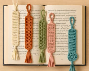 May include: A collection of six handmade crochet bookmarks in various colors, including cream, orange, green, pink, and teal. Each bookmark features a unique openwork design and a tassel at the bottom, perfect for book lovers.