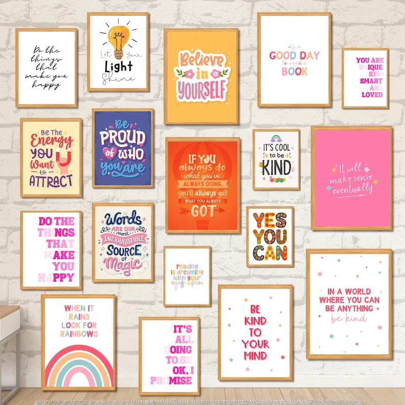 May include: A collection of framed art prints with inspirational quotes and positive affirmations. The prints feature various colors, fonts, and designs, including rainbows, light bulbs, and floral elements. The frames are a light brown color.
