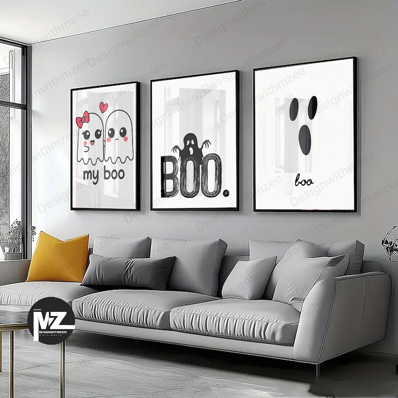 May include: Three framed Halloween art prints. The prints feature ghost illustrations with the phrases "my boo" and "boo", and the word "BOO." in a bold font. The artwork is in black and white, with black frames.