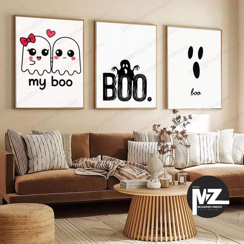 May include: Three framed Halloween-themed wall art prints. The first features two cartoon ghosts with the text "my boo." The second says "BOO." with a ghost silhouette. The third says "boo." in a minimalist style.