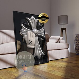 May include: A rectangular framed wall art piece featuring a large, metallic silver cross with ornate, rounded edges set against a black background. A cartoon-style hand with a black X on the palm is positioned in front of the cross. The image includes a gold circular badge reading DESIGNWITH ORIGINAL PRODUCT MZEE HQ and a circular overlay text reading DIGITAL DOWNLOAD.