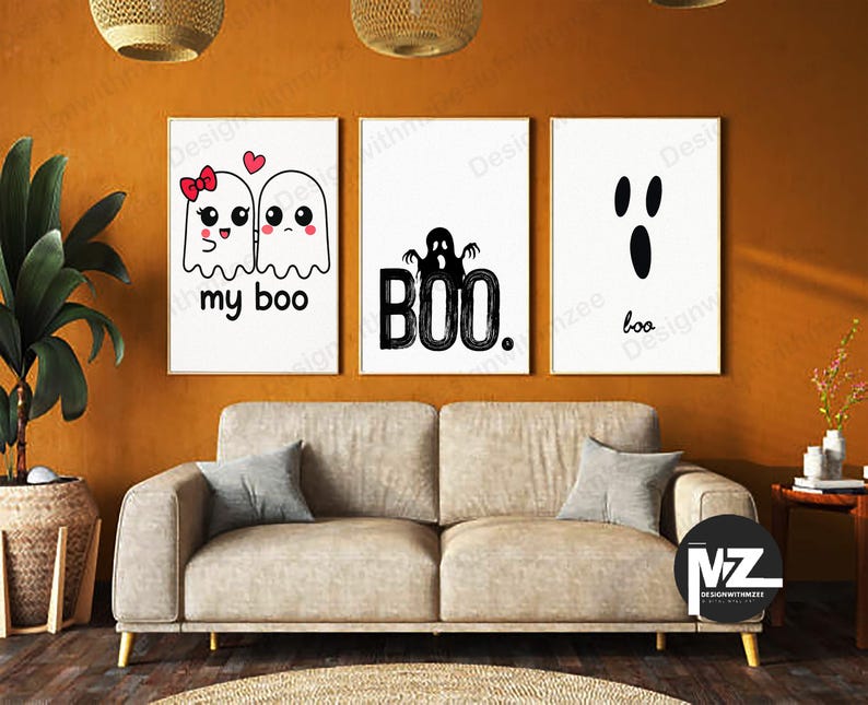 May include: Three framed Halloween-themed art prints. The left print features two cartoon ghosts with the text "my boo." The center print has a ghost and the word "BOO." The right print shows a ghost face and the word "boo."
