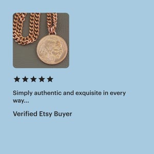 May include: A gold-toned necklace with a large circular pendant depicting a Native American profile. The pendant hangs from a chunky chain of the same colour. The image includes text: "Simply authentic and exquisite in every way... Verified Etsy Buyer."