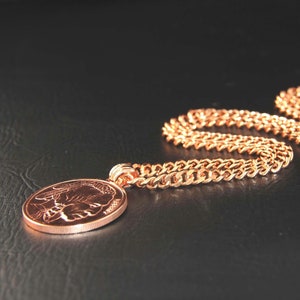 Copper Pendant with an Indian Head embossed on one side is solid copper ingot, weighs 1oz on a heavy copper curb chain.