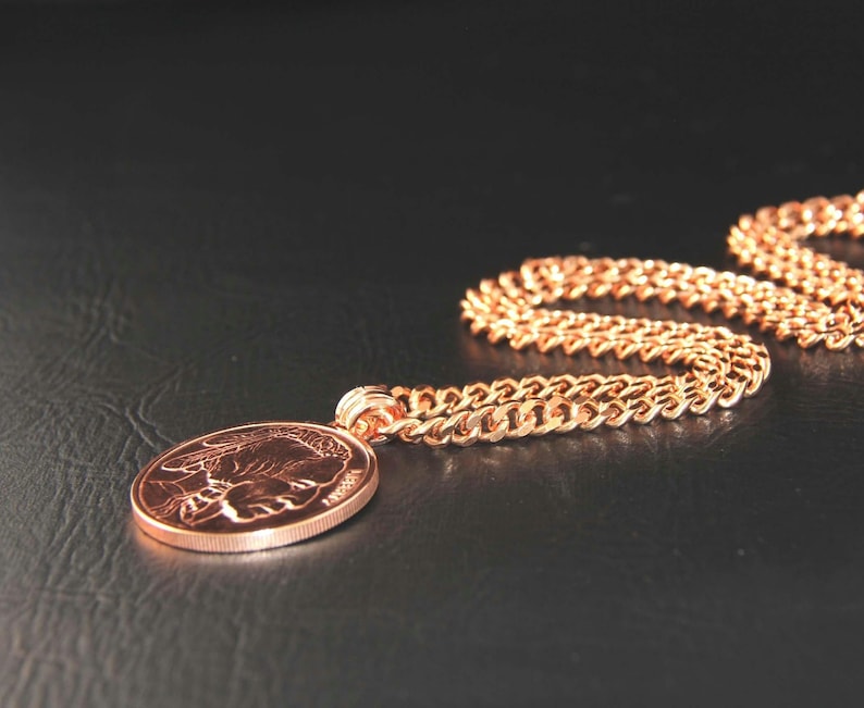 Copper Pendant with an Indian Head embossed on one side is solid copper ingot, weighs 1oz on a heavy copper curb chain.