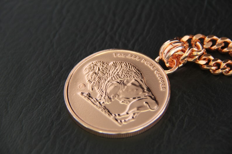 Close-up of the reverse side of the pendant - an image of a Buffalo and 1oz. 999 PURE COPPER embossed on it.