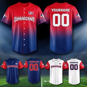 May include: Baseball jerseys in red, blue, and white, featuring the text "Dominicana" and the number "00". The jerseys have the Dominican Republic flag on the sleeves and chest. The jerseys are displayed on a green field.