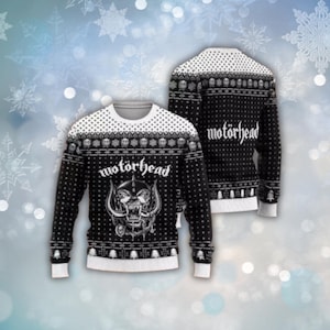 May include: Black and white Motorhead Christmas jumper featuring a skull graphic and the band's name. The jumper has a white crew neck and cuffs, with a pattern of skulls and trees. The back of the jumper also features the band's name.