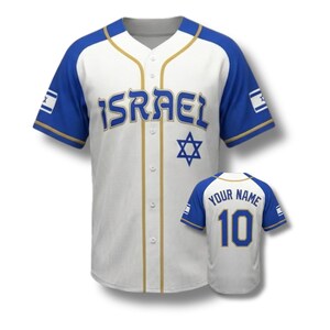 May include: White and blue baseball jersey with "ISRAEL" in blue letters across the chest and a Star of David. The jersey has blue sleeves and trim, with the Israeli flag on the sleeves. A second jersey shows "YOUR NAME" and the number 10.