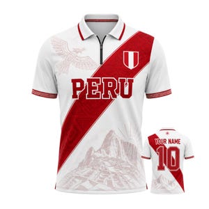 May include: White polo shirt with red detailing and the word "PERU" in bold lettering. Features a Peruvian coat of arms and a mountain landscape design. Includes a smaller version of the shirt with "YOUR NAME" and the number 10 on the back.