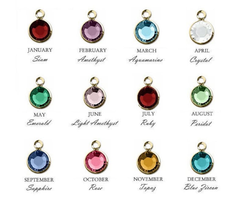 May include: Twelve small gemstone charms, each representing a different month of the year. The charms are gold-colored with a variety of colored gemstones, including red, blue, green, purple, and clear.