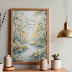 May include: A framed watercolor-style print featuring a forest landscape with a winding stream, soft green and yellow foliage, and the text "Trust in Jehovah" followed by "Psalm 115:11" in elegant dark script centered in the upper portion.
