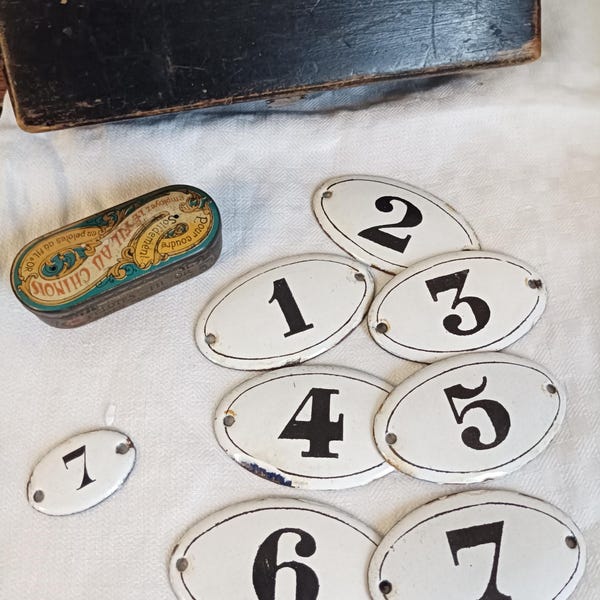 An antique numbered enamel plaque, an old French enamel number, a vintage oval enamel plaque, a vintage French enamel sign plaque