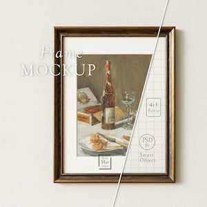 May include: A framed art print with a vintage still life scene featuring a wine bottle, glass, and food on a table. The frame is a dark brown color, and the image has a white mat. The words "Frame Mockup" are in the upper left corner.