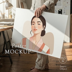 May include: A person holding a poster mockup featuring an illustration of a woman with dark hair and a pink and white striped robe. The poster has the words "Poster MOCKUP" printed on it. The poster is a PSD file with a smart object.