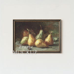 May include: A framed still life painting featuring several pears in shades of yellow and green. The artwork has a dark background and is labeled "Frame MOCKUP" in white text.