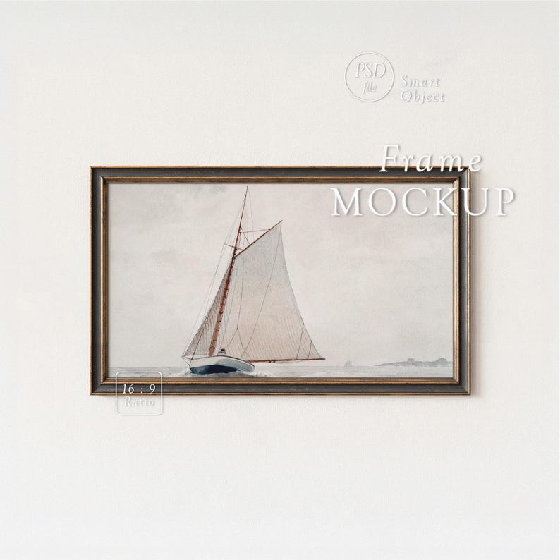 May include: A framed watercolor painting of a sailboat on the water. The artwork features a white sail, a blue hull, and a dark wooden frame. The words "Frame MOCKUP" are displayed on the image.