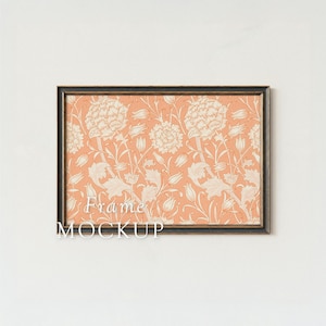May include: A framed art print featuring a floral pattern in peach and cream. The design includes stylized flowers, leaves, and stems. The frame is dark brown. The text "Frame MOCKUP" is visible.