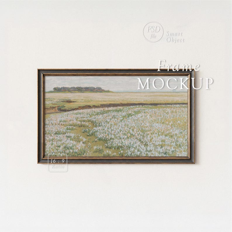 May include: A framed landscape painting featuring a field of white flowers under a cloudy sky. The artwork is in a dark wooden frame and is labeled "Frame MOCKUP" with a 16:9 ratio indicator. The overall aesthetic is vintage and serene.