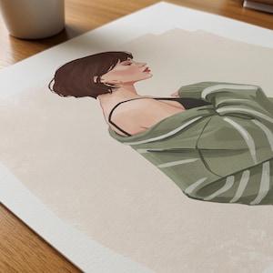May include: Illustration of a woman with short brown hair, wearing gold hoop earrings and a black top, draped in a green sweater with white stripes. The artwork is on a white paper with a beige background.
