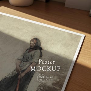 May include: A poster mockup featuring a vintage-style illustration of a woman in a headscarf, holding a staff. The poster has the words "Poster Mockup" in a serif font. The image also includes a "PSD file" and "Smart Object" logo.