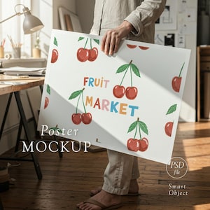May include: A white poster with a cherry pattern and the words "FRUIT MARKET" in colorful letters. The poster is held by a person. The words "Poster MOCKUP" are at the bottom.