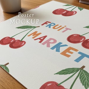 May include: A poster mockup featuring a repeating pattern of red cherries with green leaves. The words "FRUIT MARKET" are printed in colorful block letters. The words "Poster MOCKUP" are printed in white.