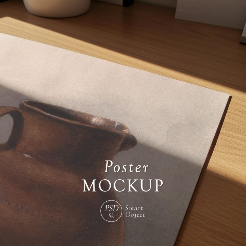 May include: A poster mockup featuring a brown ceramic jug illustration. The poster has the words "Poster MOCKUP" in a serif font. The image also includes a "PSD file" and "Smart Object" logo.