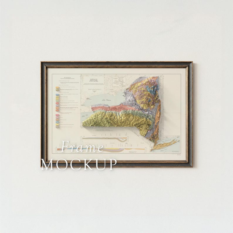 May include: Framed map of New York State with a 3D relief, showcasing the state's topography in shades of green, yellow, and brown. The map is set within a dark brown frame, with the text "Frame MOCKUP" at the bottom.