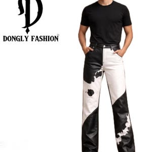 May include: Black and white patterned trousers with a cow print design. The trousers are worn with a black t-shirt. The brand logo "DONGLY FASHION" is in the upper left corner.
