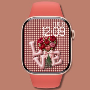 May include: A rose gold smartwatch with a coral strap shows a "LOVE" design. The watch face features a heart-shaped floral arrangement and the word "LOVE" in a stitched font, set against a red and white checked background. The time is 12:09.