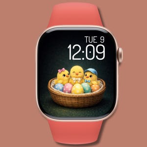 May include: A smartwatch with a coral-colored band and a gold-tone case. The watch face displays the time, 12:09, and the day, Tue 9. The screen shows three yellow chicks in a basket with colorful Easter eggs.