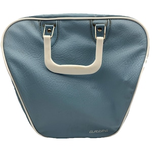 May include: A vintage blue bowling bag with a white handle and trim. The bag has a textured surface and the word "GLADDING" is printed on the bottom right corner. The bag is designed to carry bowling balls and accessories.