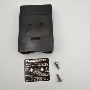 May include: A black Farberware Model 344A Skillet part with two screw fasteners. The Farberware label is also included, with text indicating it is for household use only. Made in the U.S.A.