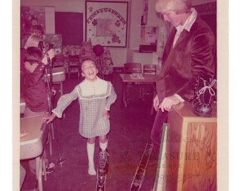 Original 1970s Snapshot – Girl on Wooden Skis, Classroom Ski Demo, Plaid Dress, Corduroy Blazer, Vintage Photo Print, Not Repro, Not Digital