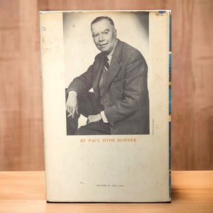 Back cover with author photo – Portrait of Paul Hyde Bonner in suit, seated, holding cigarette, against neutral background.