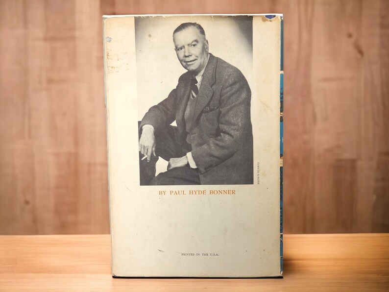 Back cover with author photo – Portrait of Paul Hyde Bonner in suit, seated, holding cigarette, against neutral background.