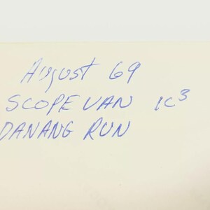 May include: A handwritten note on a white background with the text "August 69 Scope Van 1C3 Danang Run".