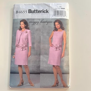May include: A Butterick sewing pattern, B4655, featuring a pink dress with a matching jacket and a sleeveless dress. The pattern includes a dress with a bow detail at the waist. The pattern is from maggy boutique.