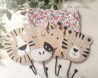 Set of 4 nursery safari hooks with handmade drawstring bag of various fabric choices. Hooks include zebra, tiger, lion and giraffe.