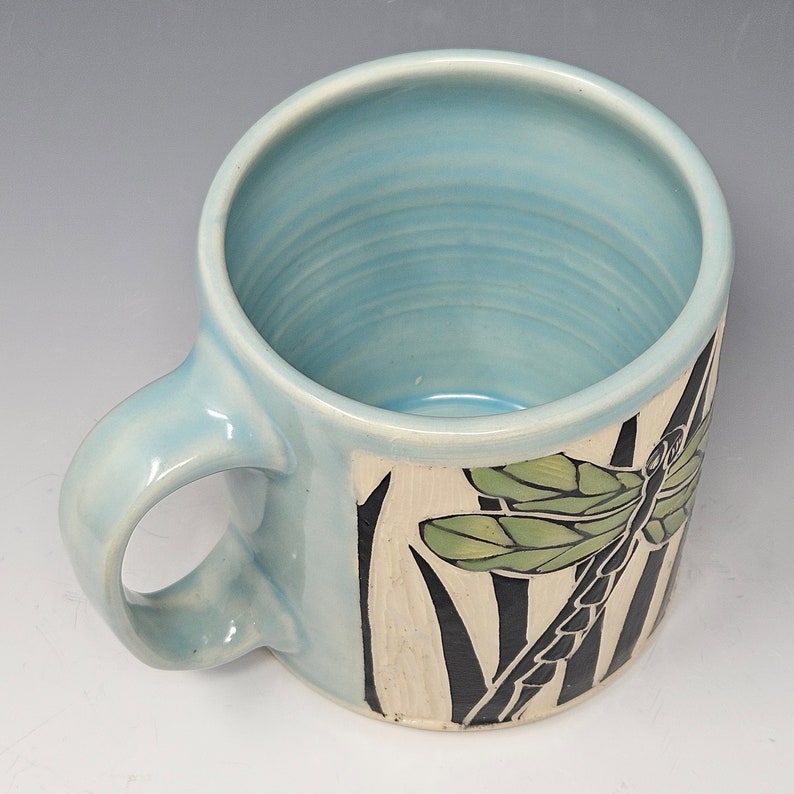 Handcrafted Sgraffito Dragonfly Mug with Blue and Green Wings -  Light Blue Glaze