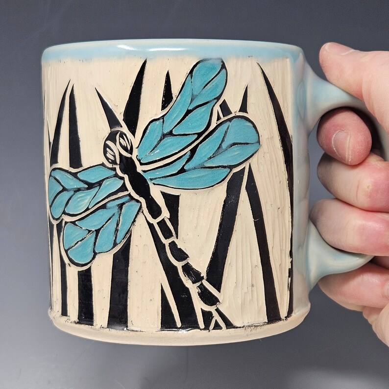 Handcrafted Sgraffito Dragonfly Mug with Blue and Green Wings -  Light Blue Glaze