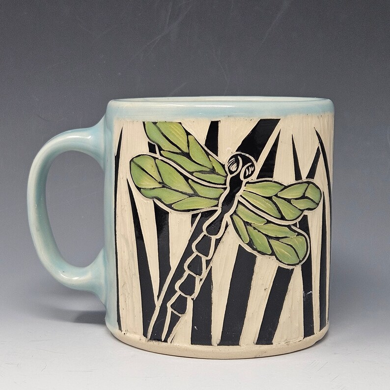 Handcrafted Sgraffito Dragonfly Mug with Blue and Green Wings -  Light Blue Glaze